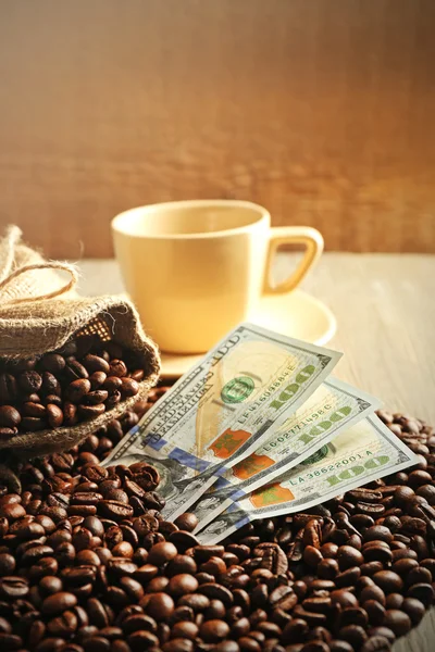 Coffee beans and dollar banknotes Royalty Free Stock Photos