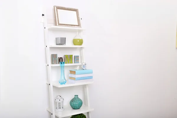 Bookcase with books and accessories — Stock Photo, Image