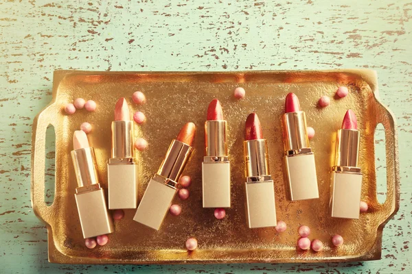 Set of lipsticks on tray — Stock Photo, Image