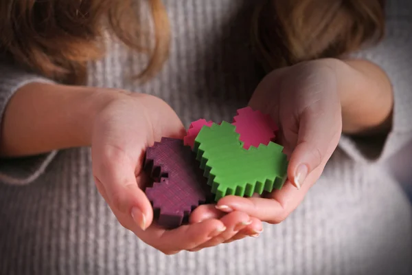 Plastic puzzle hearts — Stock Photo, Image