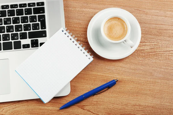 Notebook on laptop keyboard — Stock Photo, Image