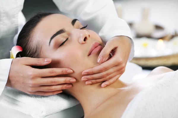 Woman relaxing with face massage — Stock Photo, Image