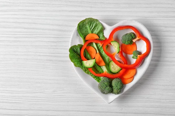 Useful cut vegetables on a plate — Stock Photo, Image