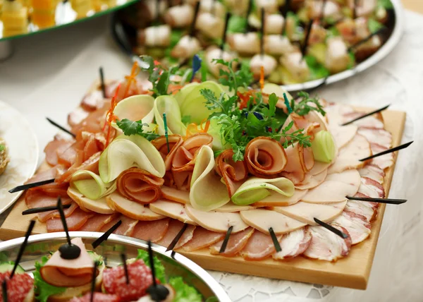 Dish with assorted snacks — Stock Photo, Image