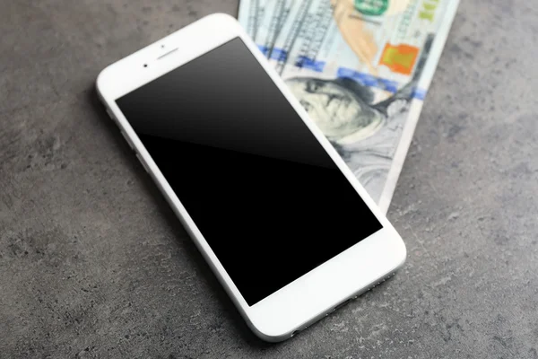 Mobile phone and money — Stock Photo, Image