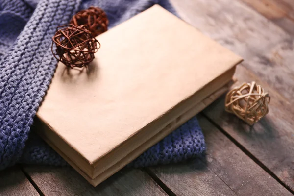 A book, decorative balls and a blanket — Stock Photo, Image