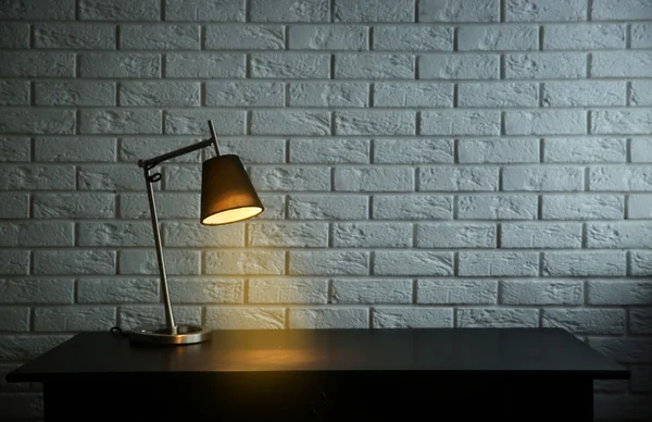 Modern lamp on desk — Stock Photo, Image