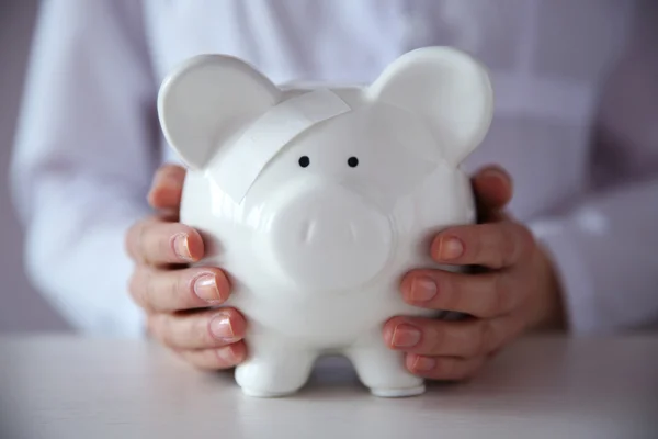 Woman holding in hands piggy bank — Stock Photo, Image