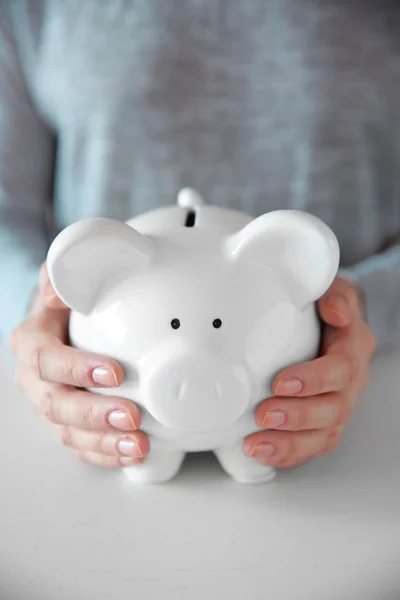 Woman holding in hands piggy bank — Stock Photo, Image