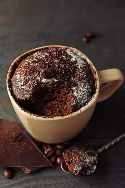 Chocolate fondant cake in cup on wooden background — Stock Photo, Image