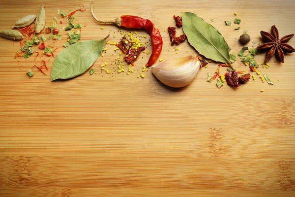 Different spices on cutting board, closeup — Stock Photo, Image