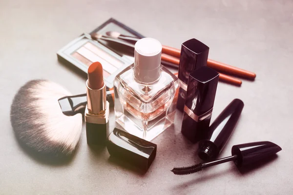 Cosmetics on light grey — Stock Image Cosmetics on light grey Stock Image
