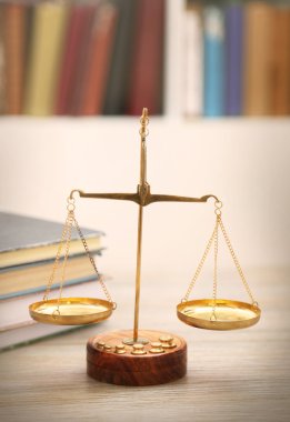 Justice scales with stack of books clipart
