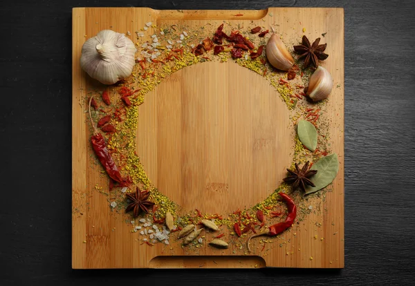 Spices round frame on cutting board