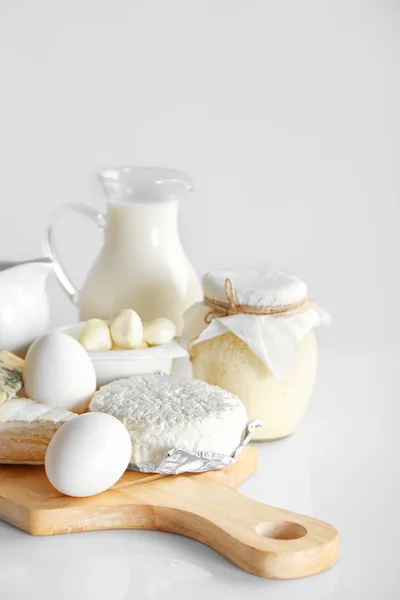 Set of fresh dairy products on wooden table, on white background — Stock Photo, Image