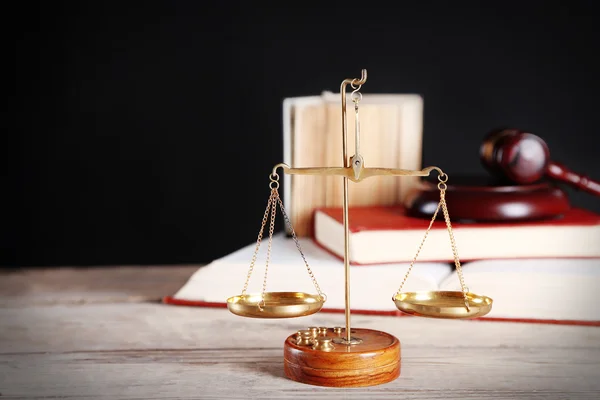 Justice scales with wooden gavel and books — Stock Photo, Image