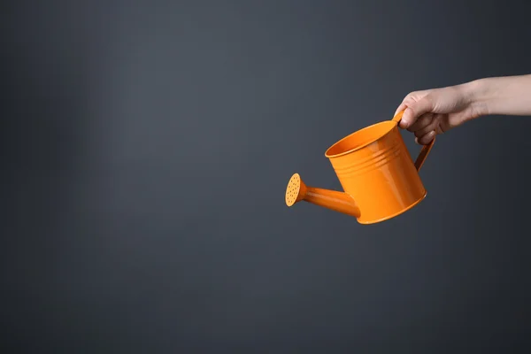 Orange metal watering can — Stock Photo, Image