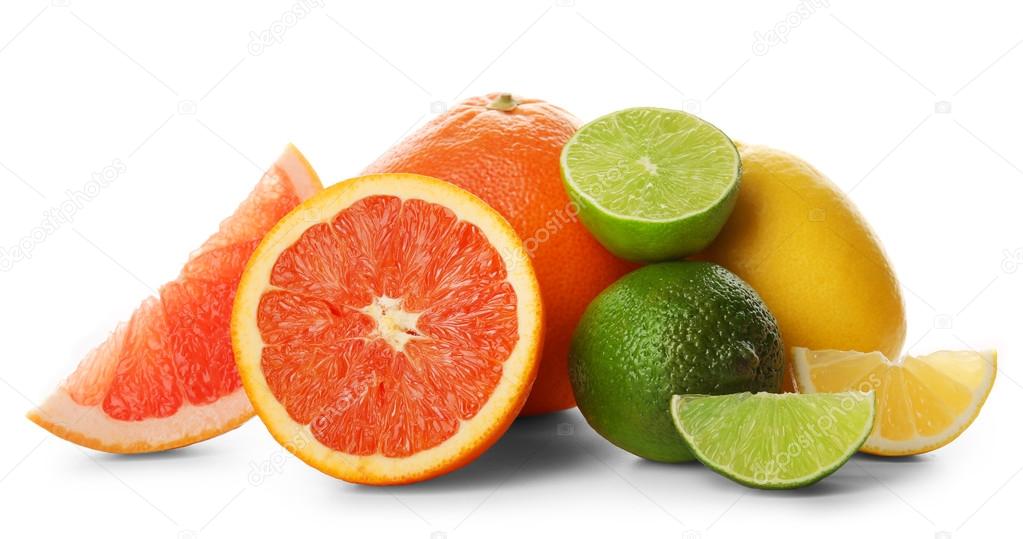 Mixed citrus fruit including lemons, grapefruits, orange and limes isolated on a white background, close up