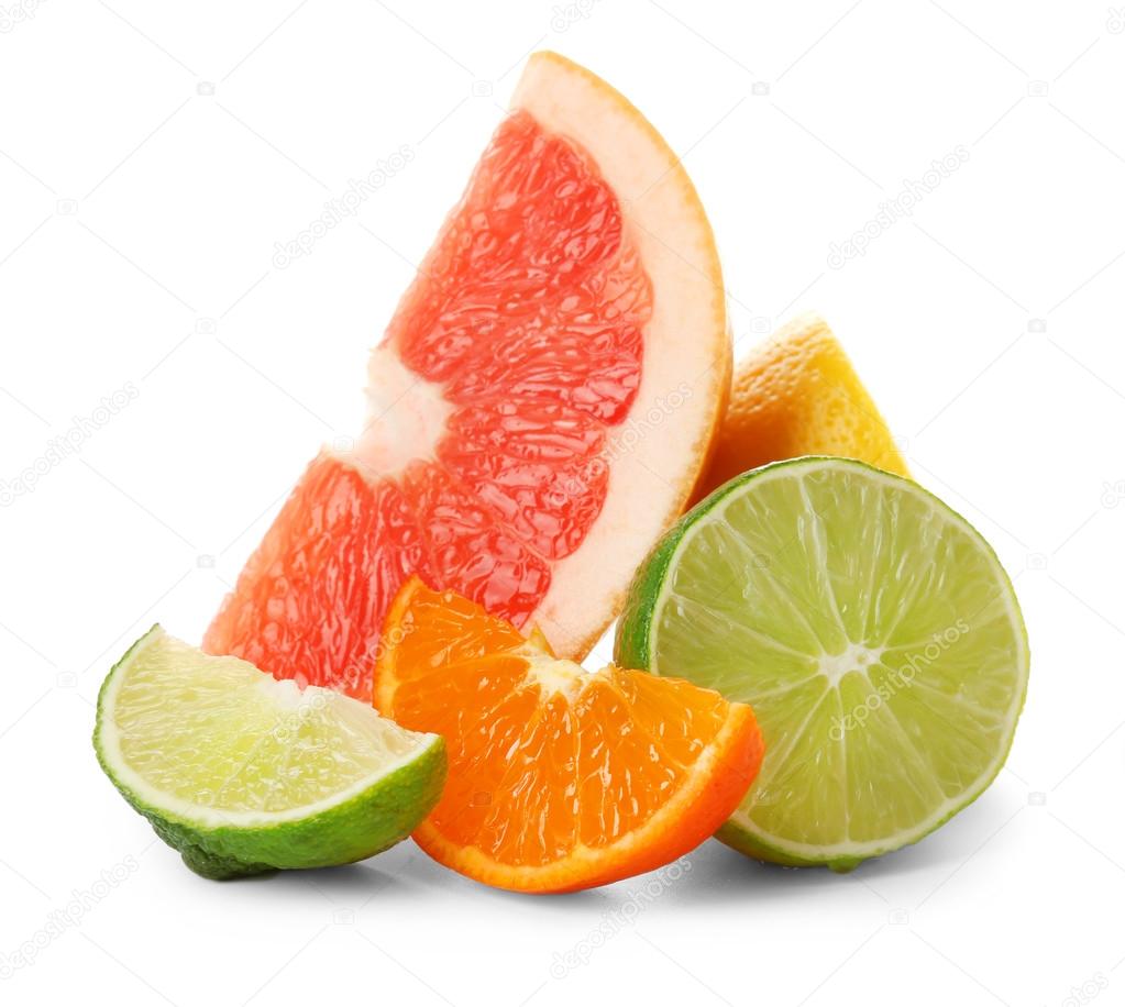 Colorful citrus slices and halves isolated on a white background, close up