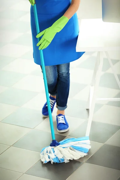 Woman cleaning floor