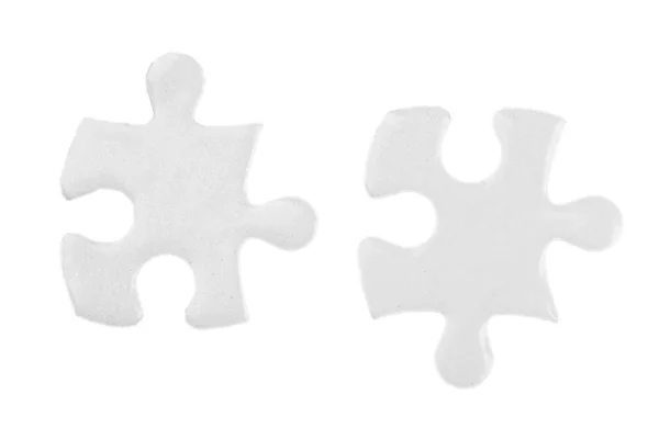 Wit puzzels op grijs — Stockfoto