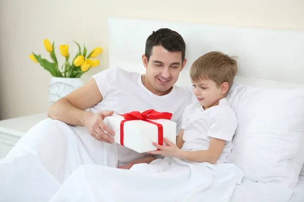 Father Giving Present His Son Bed Home — Stock Photo, Image