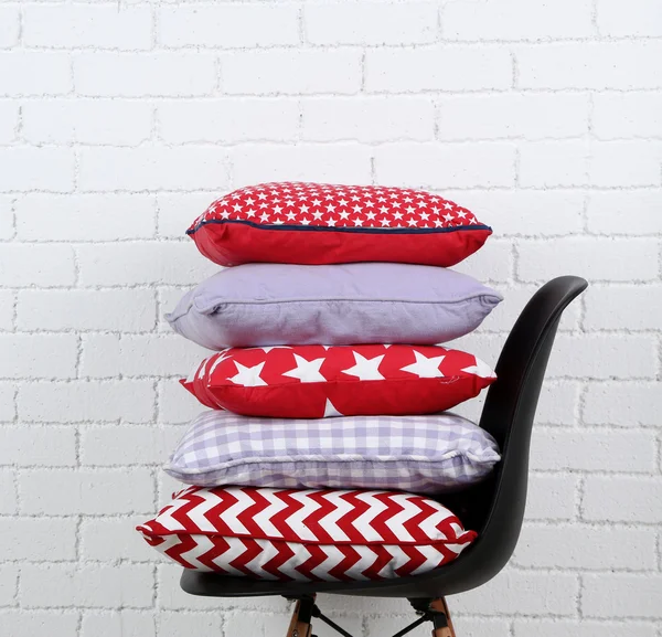 Colorful pillows on chair — Stock Photo, Image
