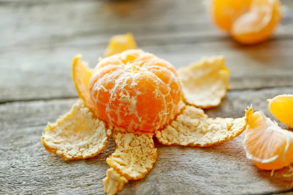 Tangerines on old wooden table — Stock Photo, Image