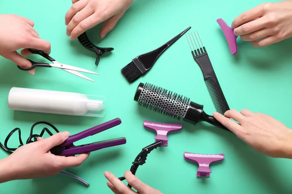 Human hands holding hairdresser set — Stock Photo, Image