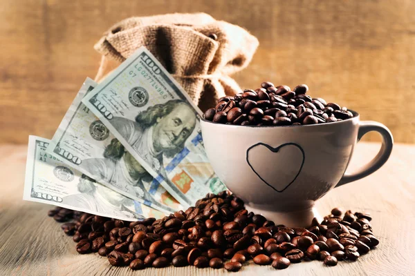 Coffee beans and dollar banknotes Royalty Free Stock Photos