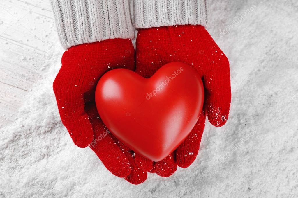 Hands in warm red gloves 