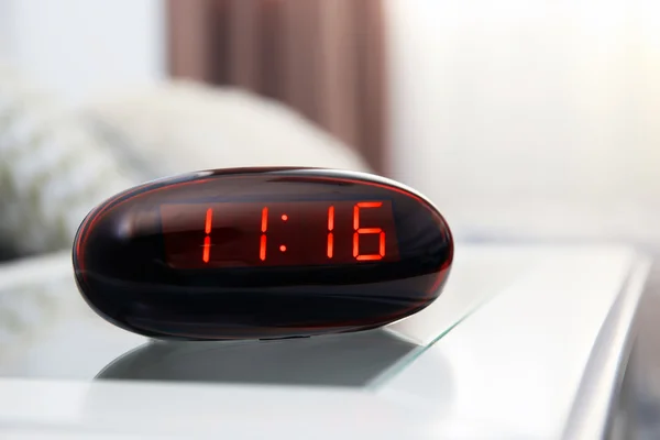 Digital clock in bedroom — Stock Photo, Image