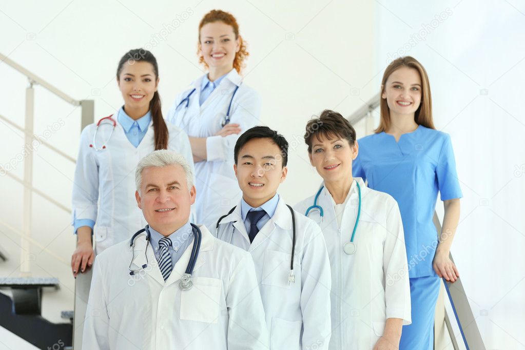 Team of smiling doctors indoors