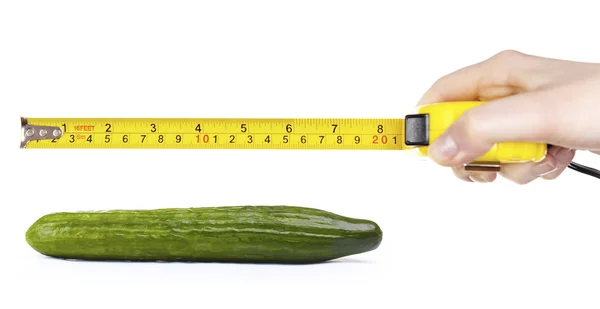 Female hand with roulette and cucumber — Stock Photo, Image