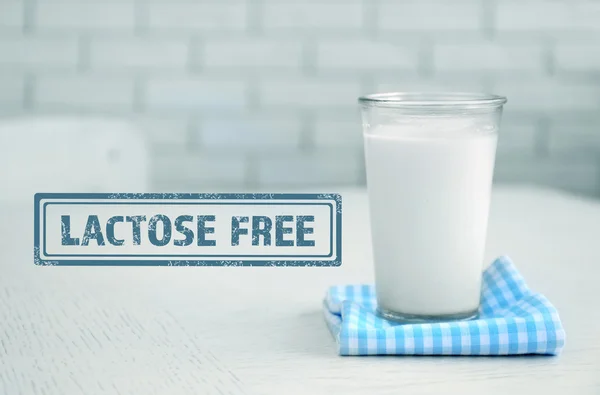 Glass of milk on wooden table — Stock Photo, Image