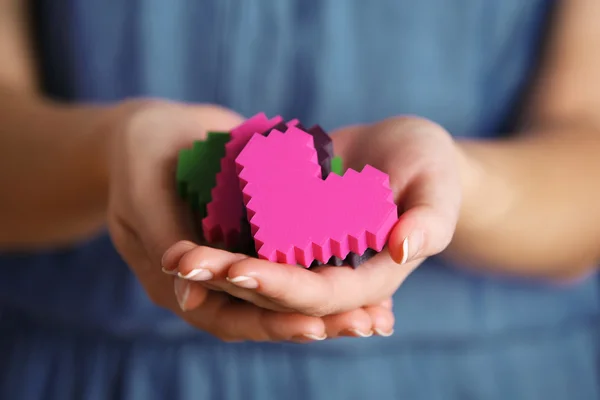 Plastic puzzle hearts — Stock Photo, Image