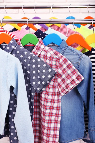Clothes for children on hangers — Stock Photo, Image
