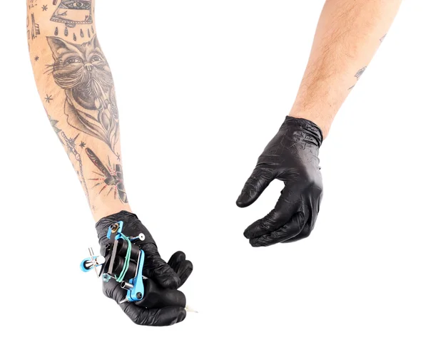 Руки татуировщика в черных перчатках — стоковое фото
