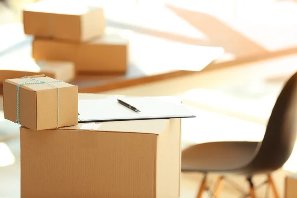 Group of parcels with clipboard — Stock Photo, Image