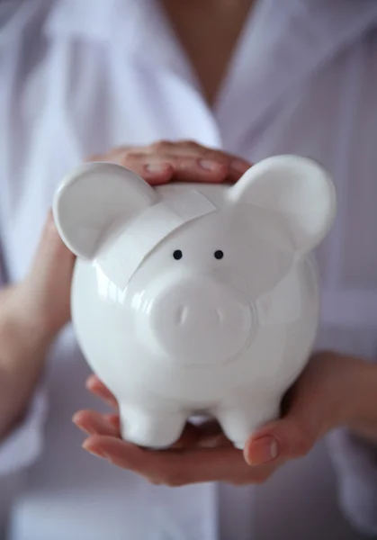 Woman holding in hands piggy bank — Stock Photo, Image