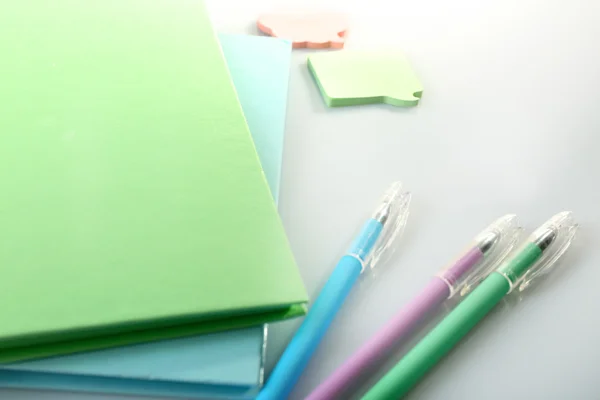 A pile of notebooks and stationary — Stock Photo, Image