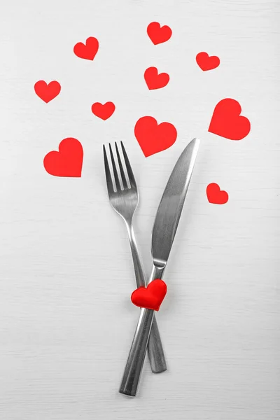 Fork and knife with paper hearts — Stock Photo, Image