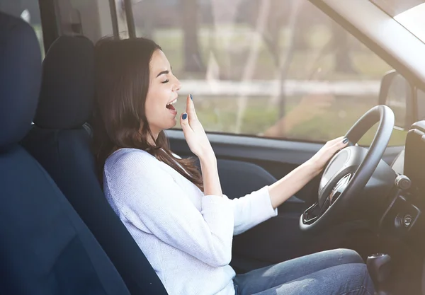 Tired woman driving car. — Stock Photo, Image
