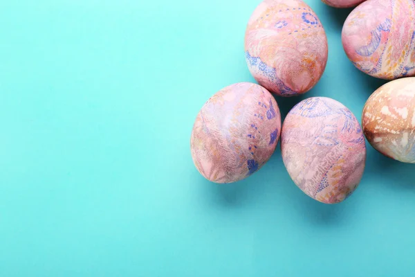 Easter eggs on blue table — Stock Photo, Image