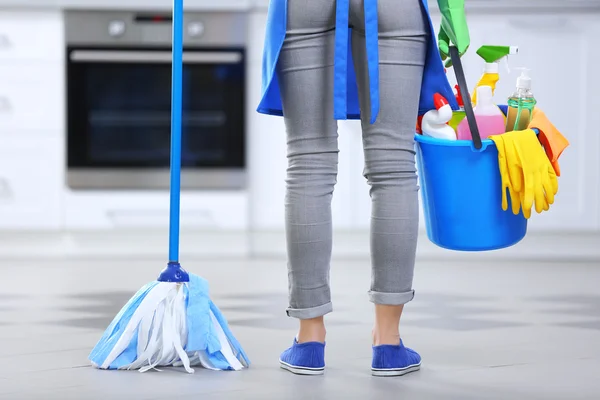 Woman with floor mop