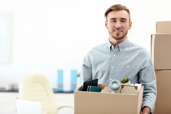 Businessman with moving box — Stock Photo, Image