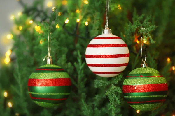 Baubles on a fir tree branch — Stock Photo, Image