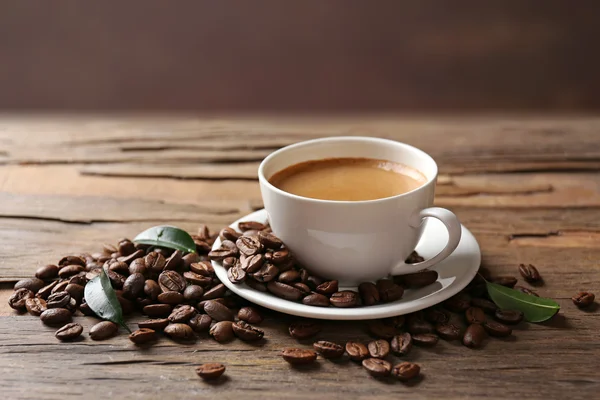 Cup of coffee on wooden table — Stock Photo, Image