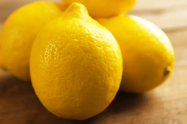 Fresh lemons on  table — Stock Photo, Image