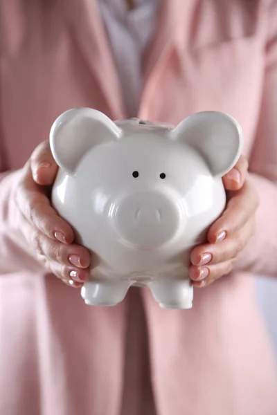 Woman holding in hands piggy bank — Stock Photo, Image